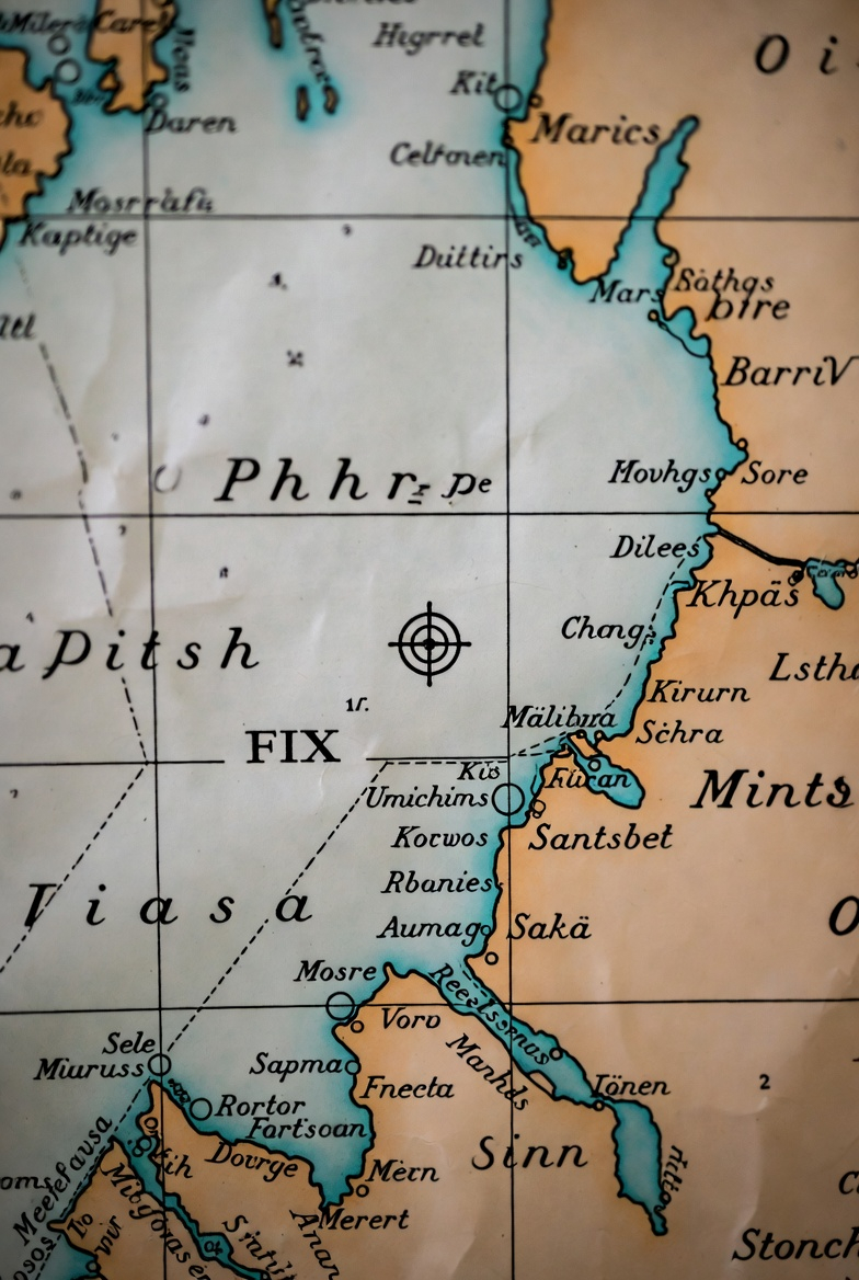 A navigational chart with a fix mark plotted: the precise intersection of bearings that establishes exact position